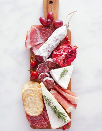 Charcuterie board with pomegranate